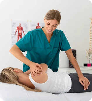 Chiropractor adjusting a patient’s shoulder and upper back