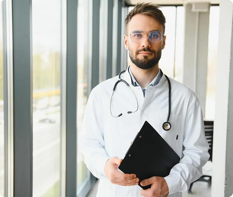 Doctor holding a clipboard at a medical clinic