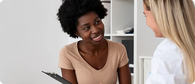 Patient discussing her health with a doctor