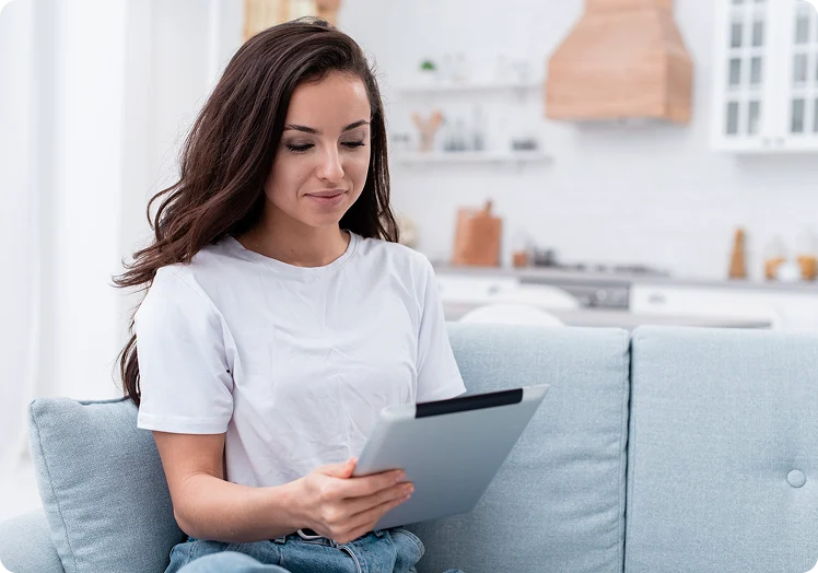 Woman using a tablet at home