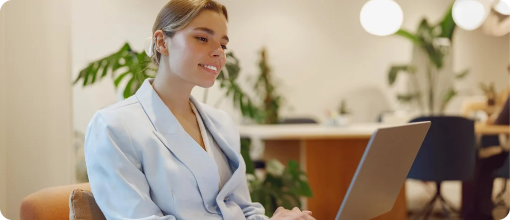 Smiling professional woman using a laptop