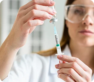 Medical professional preparing an injection