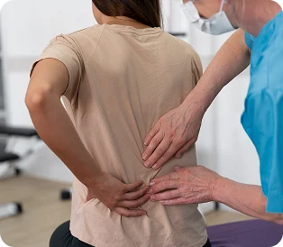 Doctor examining a patient with lower back pain