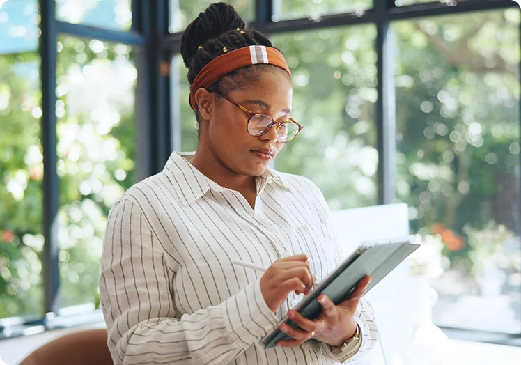 Woman reviewing primary care information on a tablet