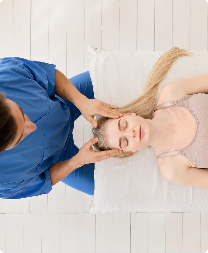 Therapist providing gentle head and neck treatment