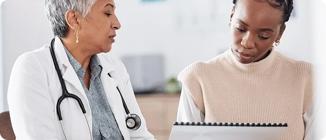 Patient discussing her health concerns with a doctor