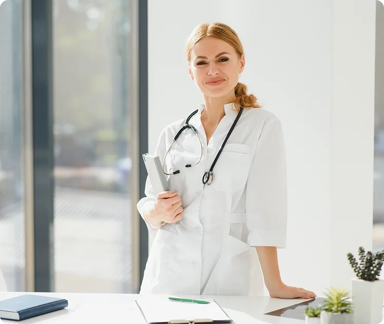 Wellness provider holding a tablet at the clinic